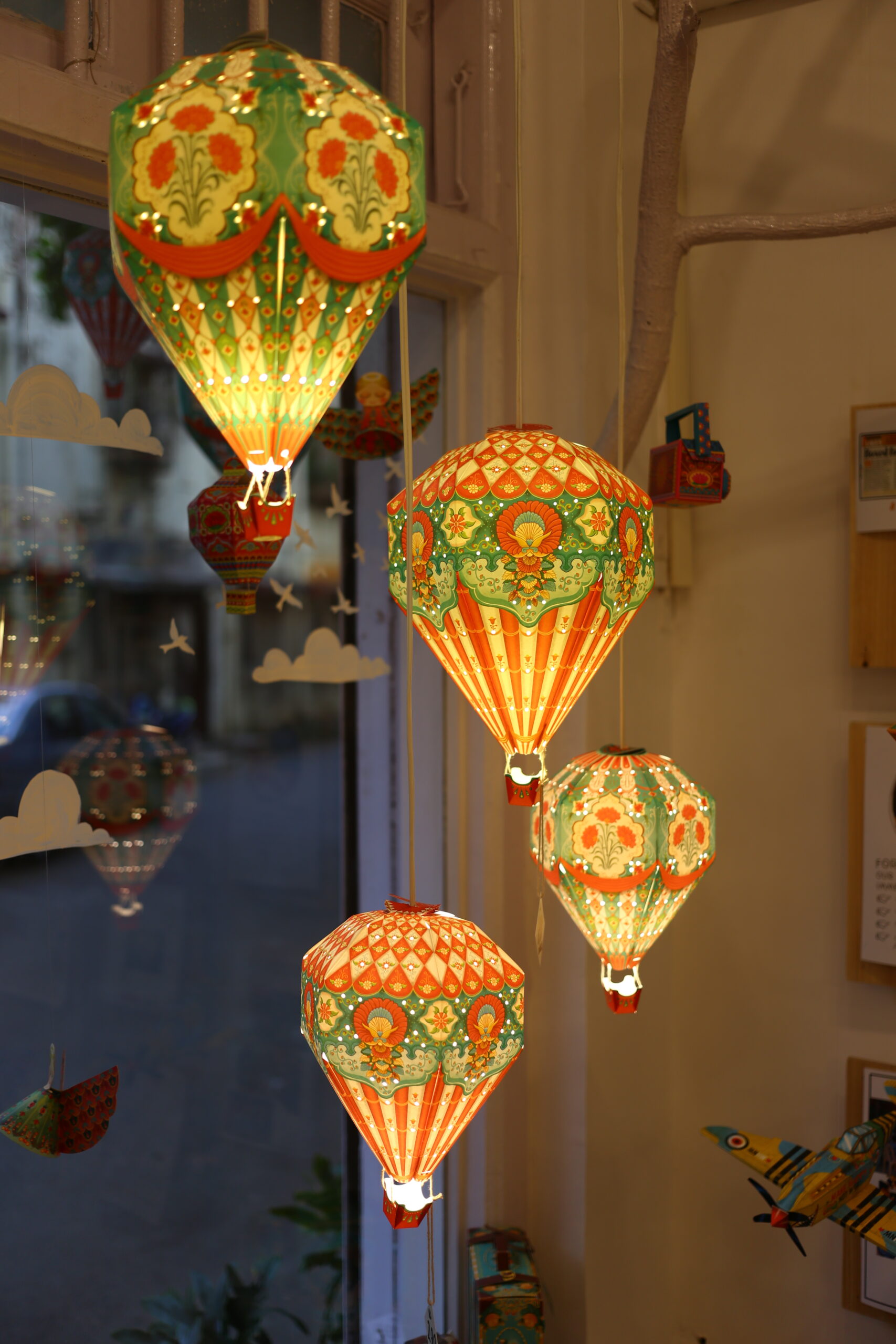 large and small hot air balloon paper lamps to create cosy lighting